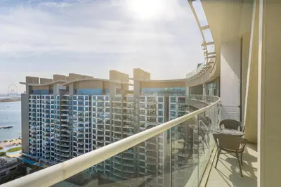 a balcony with a view of a building at Maison Privee - Elegant Palm Retreat with Iconic Sea & Marina Vws in Dubai