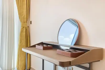 a dressing table with a mirror on top of it at Luxury 2BR with Balcony, Burj Khalifa View & LED Night Show Downtown in Dubai
