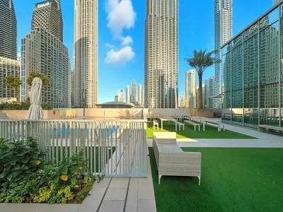 a view of a city skyline with tall buildings at Burj Khalifa View Next to Dubai Mall Sleeps 12 in Dubai