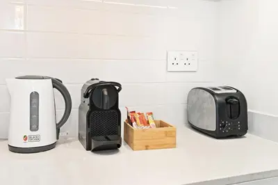 a kitchen counter with a toaster and a toaster at Burj Khalifa View Next to Dubai Mall Sleeps 12 in Dubai