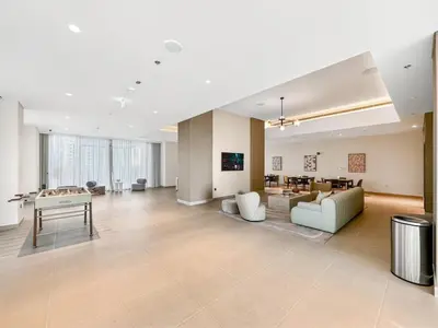 a large living room with a pool table in it at Burj Khalifa View Next to Dubai Mall Sleeps 12 in Dubai