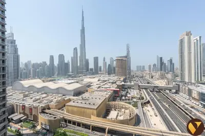 a view of a city with buildings and train tracks at Vogue Downtown Vida Dubai Mall, Direct Access to Dubai Mall via Climate Controlled bridge, Two Bedroom Apartment with Full Burj Khalifa View from Balcony and Access to all Amenities in Dubai