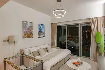 a bedroom with a large bed and a large window at Highest floor - 5 mins walk to Dubai Mall and Burj Khalifa in Dubai