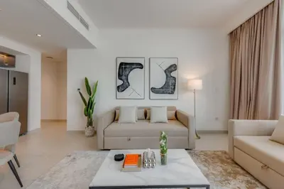 a living room with a couch and a table at Walk to Dubai Mall and Burj Khalifa Luxury 2 Bed - sleep up to 10 in Dubai