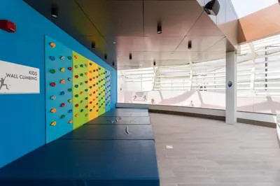 a climbing wall in a building with a climbing gym at GuestReady - Spacious 1Bed l Near Butterfly Garden in Dubai