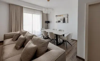 a living room with a couch and a table at 2 bedroom with a full sea view ! BAHAR in Dubai