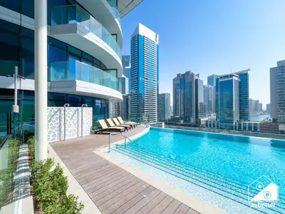 a swimming pool on the roof of a building at Luxurious 1BR with Balcony & Premium Stay in Downtown in Dubai
