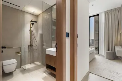 a bathroom with a toilet and a sink and a shower at Private Pool Retreat Chic 2BR Sleeps 8 in Dubai