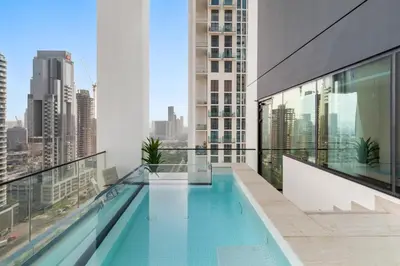 a swimming pool on the roof of a building at Private Pool Retreat Chic 2BR Sleeps 8 in Dubai