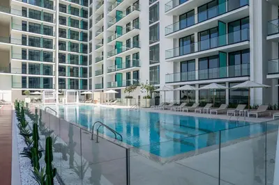 an image of a swimming pool in a building at Stylish High-Floor Studio in Binghatti Azure! in Dubai