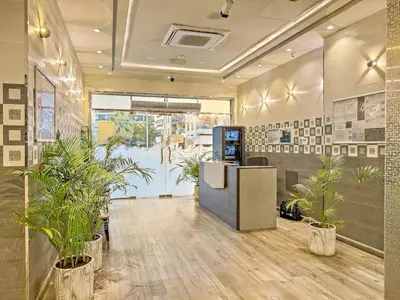 an office with potted plants in a room at FIRST CLASS Studio Cozy Marble Elegance in Dubai