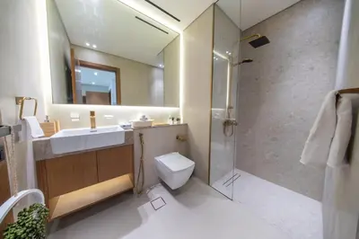 a bathroom with a sink toilet and a shower at Fully Furnished I Circle Mall I Sleeps 4 in Dubai