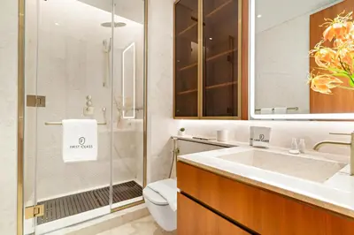 a bathroom with a sink and a toilet and a shower at FIRST CLASS 4BR Elegant Beach House Retreat in Dubai
