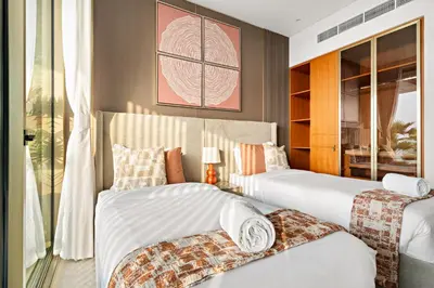 a bedroom with two beds and a window at FIRST CLASS 4BR Elegant Beach House Retreat in Dubai