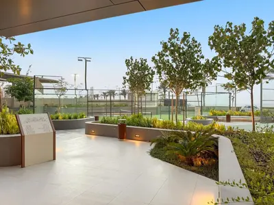 a lobby with plants and trees in a building at FIRST CLASS 4BR Elegant Beach House Retreat in Dubai