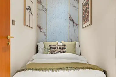 a bedroom with a bed in a room at FIRST CLASS 4BR Elegant Beach House Retreat in Dubai