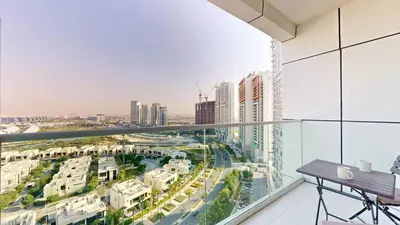 a balcony with a view of a city at Vacationer I Luxury Studio I Scenic Golf Course & Skyline Views I Carson B Tower in Dubai Marina