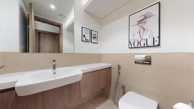 a bathroom with a sink and a toilet at Vacationer l Luxury Comfort 2 Bed Villa with Garden & Garage I Motor City in Dubai