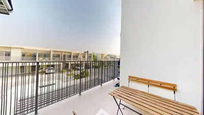 a balcony with a bench on a building at Vacationer l Luxury Comfort 2 Bed Villa with Garden & Garage I Motor City in Dubai