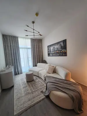 a living room with a white couch and a rug at City View Apartment 5 min to Downtown and 5 min to World Trade Center DIFC in Dubai