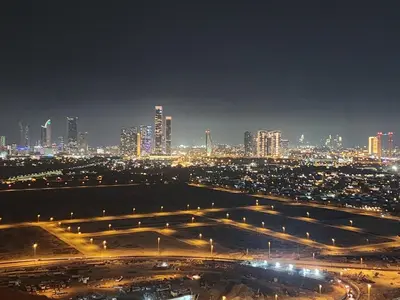 a view of a city at night with lights at City View Apartment 5 min to Downtown and 5 min to World Trade Center DIFC in Dubai