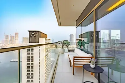 an apartment balcony with a view of the city at Elegant 2BR with Sea View & Direct Beach Access in Dubai