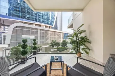 a balcony with a table and chairs in a building at Millionaire Residence-Infinity Pool-Business Bay in Dubai