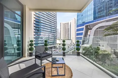 an apartment balcony with a view of a city at Millionaire Residence-Infinity Pool-Business Bay in Dubai