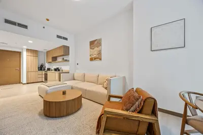 a living room with a couch and a table at Millionaire Residence-Infinity Pool-Business Bay in Dubai