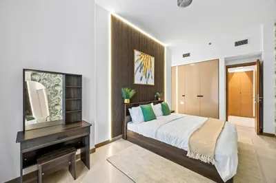 a bedroom with a bed and a mirror and a television at Millionaire Residence-Infinity Pool-Business Bay in Dubai