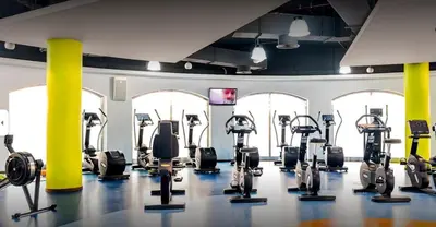 a gym with several treadmills and cardio machines at HiGuests - Fancy 1BR Apt With Aerial Marina Views in JBR in Dubai