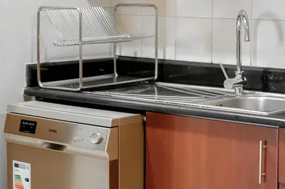 a kitchen with a sink and a counter top at HiGuests - Fancy 1BR Apt With Aerial Marina Views in JBR in Dubai