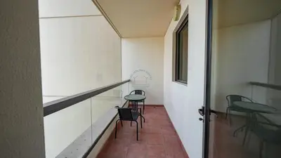 a hallway with two chairs and a stair case at Premium 1BR With Stunning Marina & Sea Views in Dubai