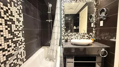 a bathroom with a sink and a toilet on a counter at DAMAC - Bays Edge 1BR - Burj Khalifa Views & Pool in Dubai