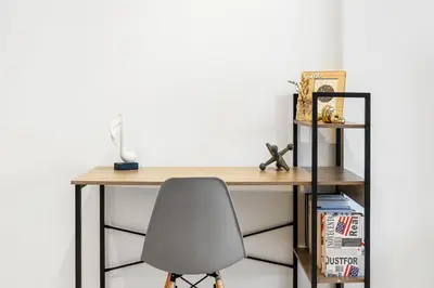 a desk with a chair in a room at Downtown Comfort Spacious 1BR in Burj Royale in Dubai