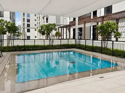 a swimming pool in the middle of a building at New 3BD in Grove Creek Beach with Stunning View in Dubai