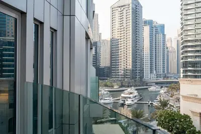 a view of a river with boats in a city at 1BR w Marina Views & Balcony in Dubai