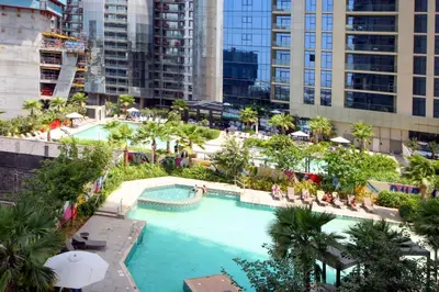 an overhead view of a swimming pool in a city at Luxury Studio in Aykon Tower - Pool & Gym Access in Dubai