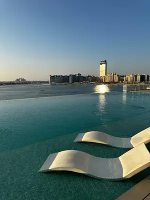 a sculpture sitting on top of a body of water at OceanView 1bed apartment with Private Beach in Dubai