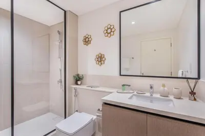 a bathroom with a toilet and a sink and a shower at Downtown Luxury 2 Bed Apartment in Dubai