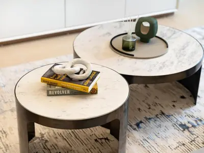 two tables with books and a donut on them at JBR's Luxury 2BDR with Dubai Eye, Palm & Marina Views - Direct Beach Access in Dubai