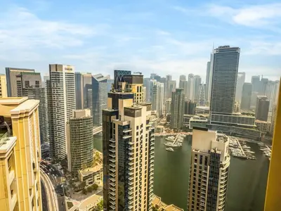 an aerial view of a large city with buildings at JBR's Luxury 2BDR with Dubai Eye, Palm & Marina Views - Direct Beach Access in Dubai