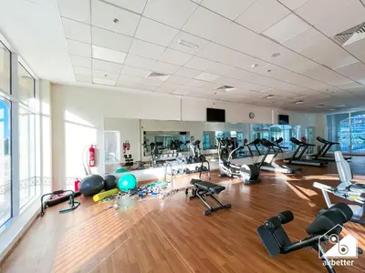 a gym with a lot of treadmills and exercise equipment at Relaxing ST Getaway l Balcony, Pool & Gym Access in Dubai