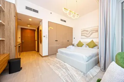 a bedroom with a white bed in a room at Luxury Studio Retreat Canal View and City Life in Dubai