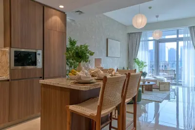 a kitchen and dining room with a table and chairs at Luxury 1BR Apt Dowtown Dubai Imperial Avenue with Burj Khalifa Views in Dubai
