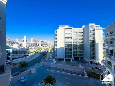 an aerial view of a city with tall buildings at Elegant Studio with Balcony & Full Amenities in Dubai