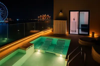 a small swimming pool on a balcony at night at JBR Dubai VIP Lux Penthouse priv Pool cinema Limo tranfer-housekeeper in Dubai
