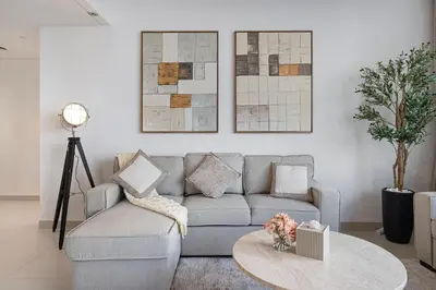 a living room with a couch and a table at Mahogany 18 - 2BR 10 Guests - Walk to Dubai Mall in Dubai