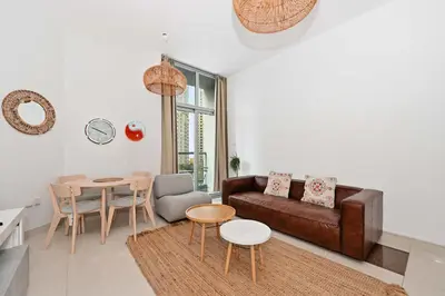 a living room with a couch and a table at Fantastic 2 Bed - Marina in Dubai