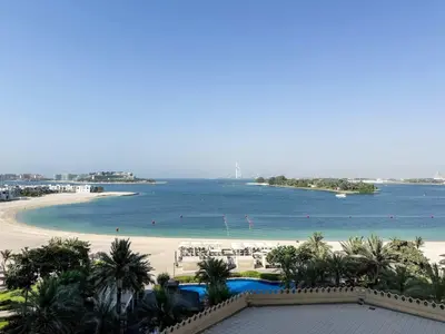 a view of a beach and the ocean at Sea View Beachfront 3BR Apartment - Shoreline 6 in Dubai